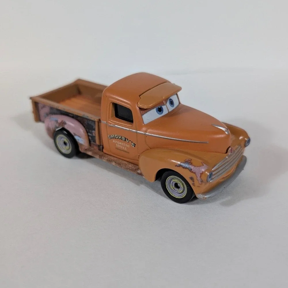 Disney Pixar Cars Smokey Diecast Truck Mattel DXV37 Orange Piston Cup Racing